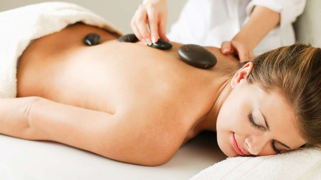 Save $81 on a Relaxing 70-Minute Hot Stone Oil Massage or Upgrade to Add a Herbal Foot Spa $49