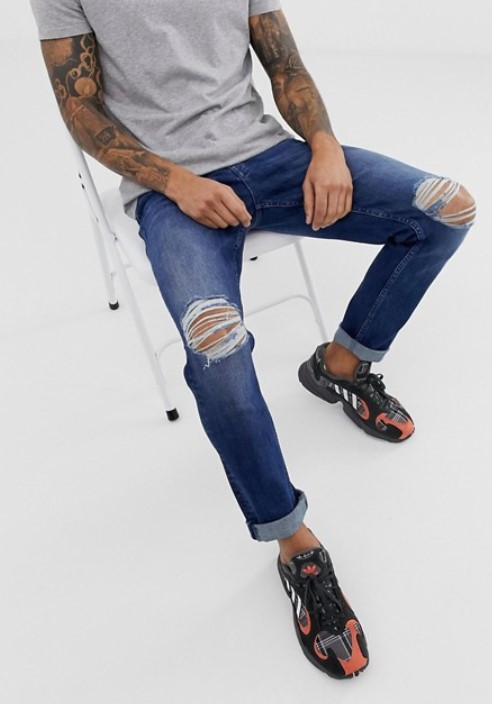 ASOS DESIGN stretch slim jeans in dark wash blue with knee rips $60.00